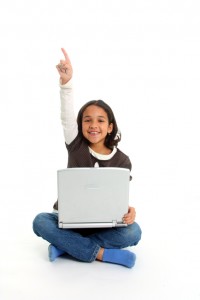 Mixed Race girl on floor with a computer